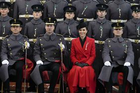 Prince William, Prince of Wales and Catherine, Princess of Wales sit for an official photo with The Prince of Wales's company during a visit to the 1st Battalion Welsh Guards