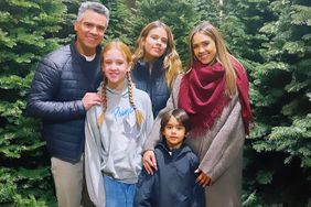 jessica alba poses in front of the tree with family: