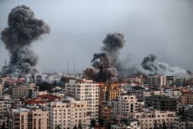 Smoke rises over the buildings as the Israeli airstrikes continue in Al-Rimal Neighbourhood of Gaza City, Gaza on October 9, 2023