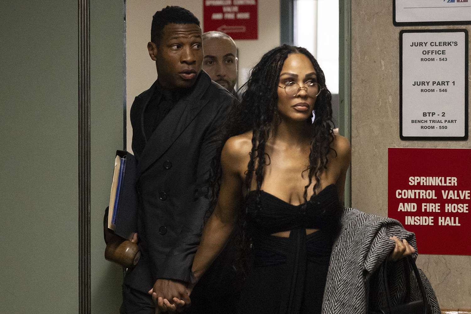 Jonathan Majors, left, and Meagan Good arrive at court for a trial on his domestic violence case, Monday, Dec. 4, 2023, in New York