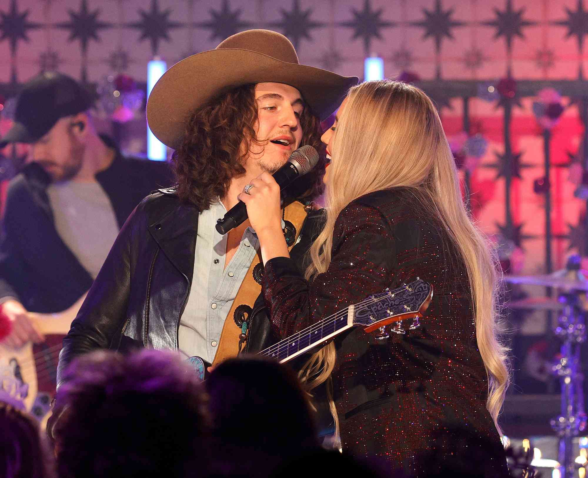 Cade Foehner and Gabby Barrett perform during the New Year's Eve Live Nashville's Big Bash at Casa Rosa in Nashville, Tennessee