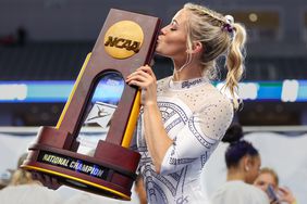 LSU's Olivia Dunne kisses the championship trophy following the NCAA Women's Gymnastics Championships at Dickies Arena in Fort Worth, TX NCAA Gymnastics NCAA Women's Gymnastics Championships Finals, Fort Worth, USA - 20 Apr 2024