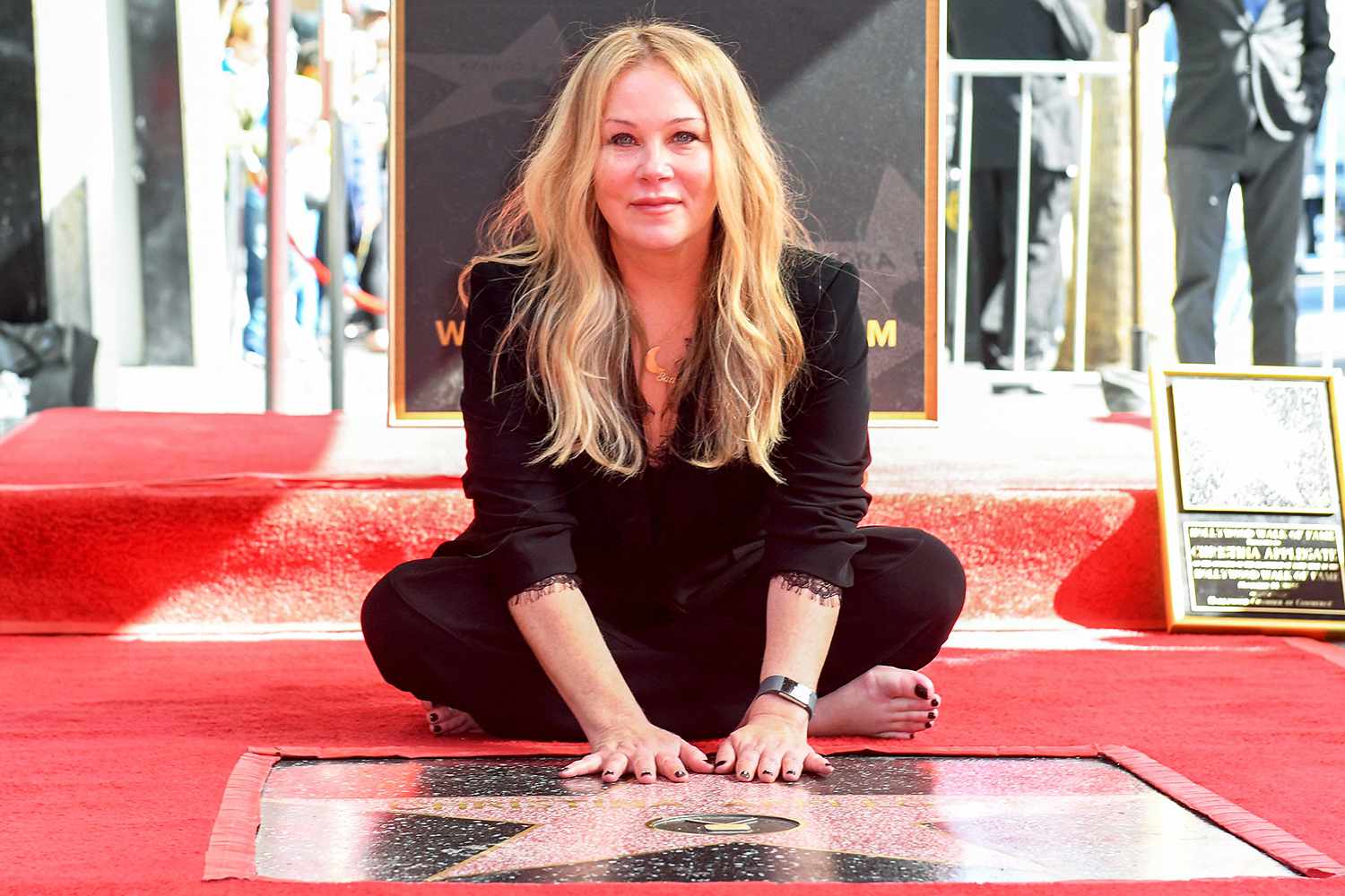 Christina Applegate poses for photos with her newly unveiled Hollywood Walk of Fame star in Hollywood, California, on November 14, 2022.