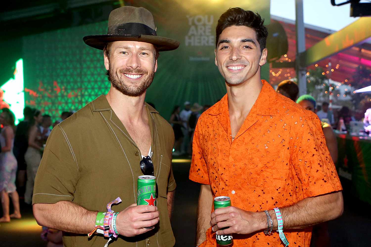 Glen Powell and Taylor Zakhar Perez enjoy a Heineken at the Heineken House at the 2022 Coachella Valley Music and Arts Festival on April 15, 2022 in Indio, California. 