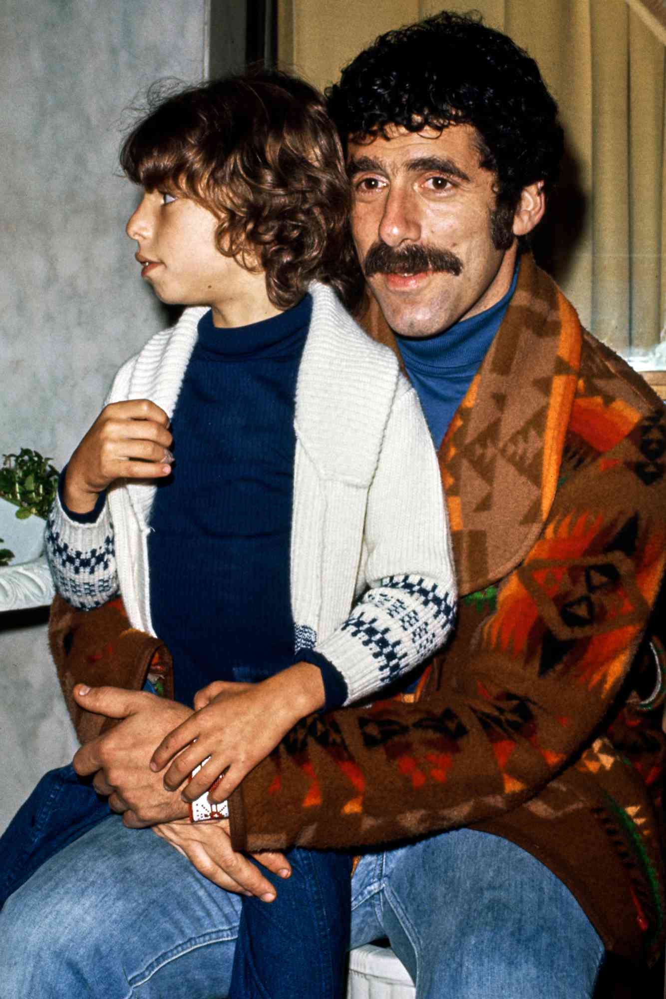 American actor Elliott Gould attends an event with his son Jason Gould, US, circa 1975.