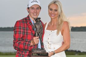 Matthew Fitzpatrick of England holds the trophy with girlfriend, Katherine Gaal, after the final round of the RBC Heritage