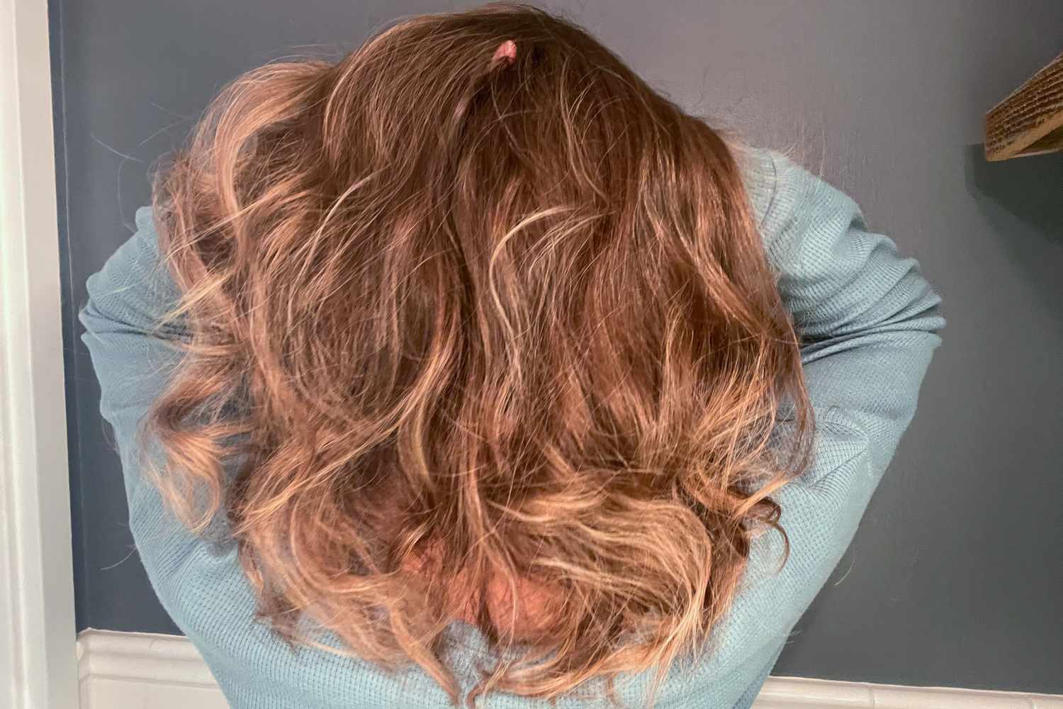 A person using their hair after using the Vintage Cosmetic Company Satin Heatless Foam Hair Curler