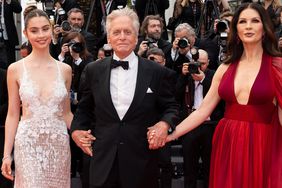 CANNES, FRANCE - MAY 16: (L-R) Carys Zeta Douglas, Michael Douglas and Catherine Zeta-Jones attend the "Jeanne du Barry" Screening & opening ceremony red carpet at the 76th annual Cannes film festival at Palais des Festivals on May 16, 2023 in Cannes, France. 