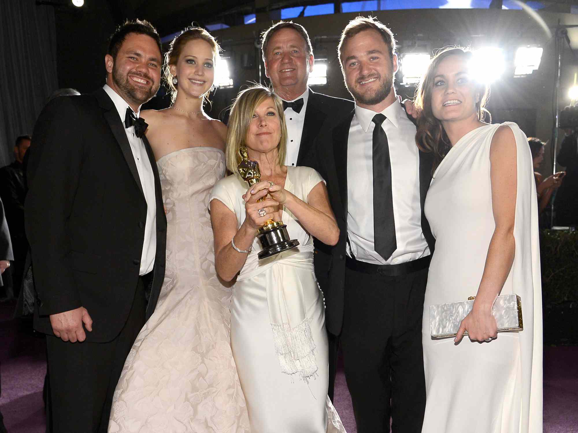 Jennifer Lawrence with her parents, Karen Lawrence and Gary Lawrence, and brothers, Ben Lawrence and Blaine Lawrence, at the Oscars Governors Ball in 2013.