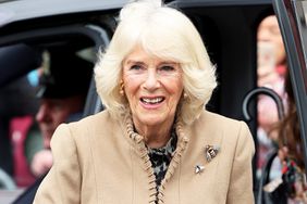 Queen Camilla smiles as she arrives for her visit to the Farmers' Market on March 27, 2024 in Shrewsbury, England.