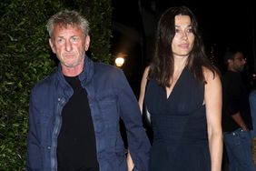 Sean Penn, 62, and Olga Korotkova, 43, lovingly hold hands as the couple are seen exiting Italian eatery Giorgio Baldi