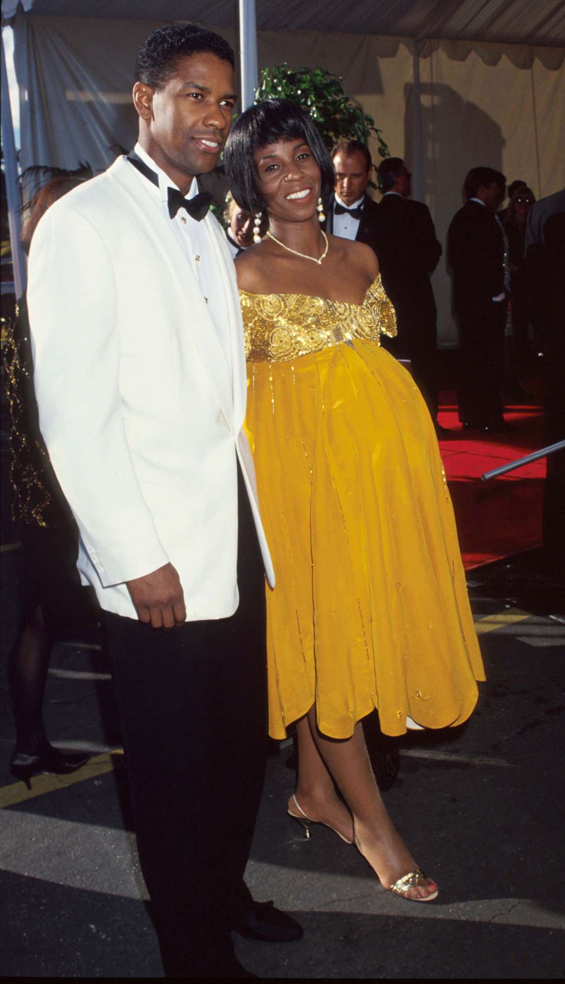 Denzel Washington poses with wife Paulette Washington March 25, 1991 in Los Angeles, CA. The Academy Awards are the foremost national film awards in the US and are given annually by the Academy of Motion Picture Arts and Sciences for excellence in the creation and production of motion pictures