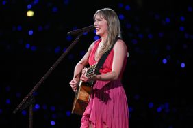 Taylor Swift Playing Guitar Smiling Singing into Microphone Pink Dress 'The Eras Tour' Stockholm, Sweden
