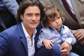 Orlando Bloom and his son Flynn Bloom attend the ceremony honoring Orlando Bloom with a Star on The Hollywood Walk of Fame on April 2, 2014 in Hollywood, California.