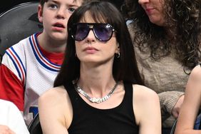  Anne Hathaway attends the game between the Atlanta Hawks and the Charlotte Hornets at State Farm Arena on March 23, 2024 in Atlanta, Georgia.