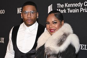 Nelly (L) and US singer-songwriter Ashanti arrive for the 25th Annual Mark Twain Prize For American Humor at the John F. Kennedy Center