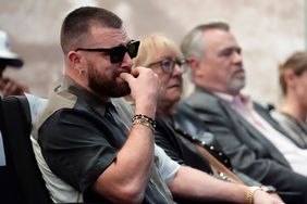 Philadelphia Eagles' Jason Kelce's family, from left, Kansas City Chiefs' Travis Kelce, mother, Donna Kelce, father, Ed Kelce, and wife, Kylie McDevitt Kelce, listens as Jason Kelce announces his retirement at an NFL football press conference in Philadelphia, Monday, March 4, 2024.