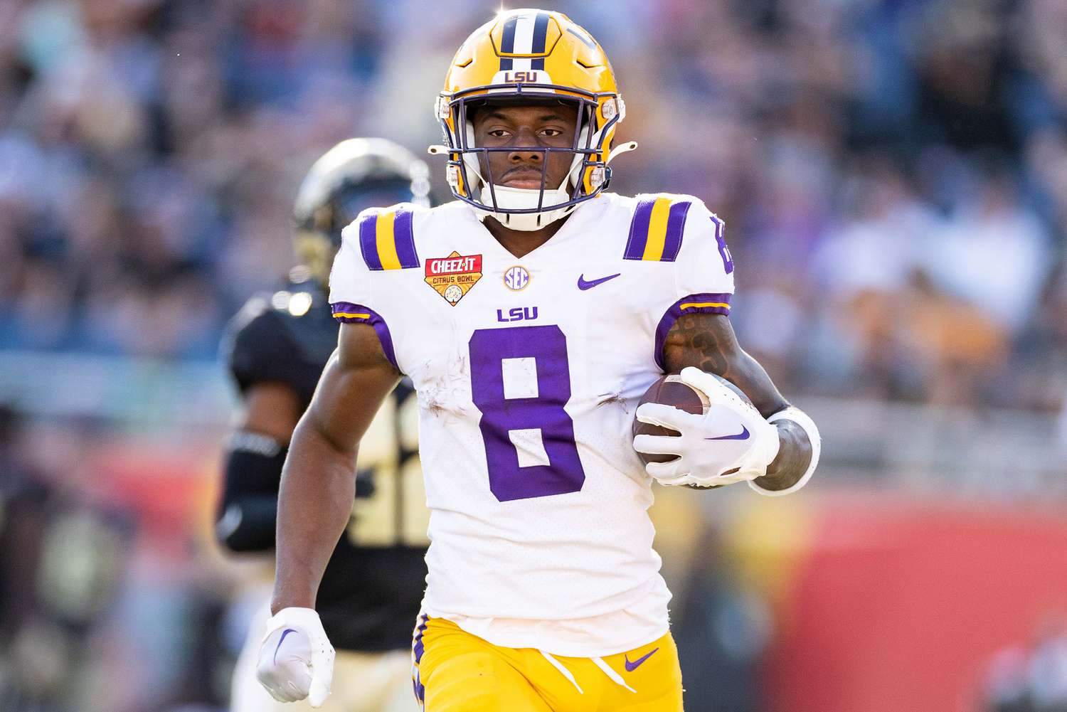 Jan 2, 2023; Orlando, FL, USA; LSU Tigers wide receiver Malik Nabers (8) rushes with the ball for a touchdown during the second half against the Purdue Boilermakers at Camping World Stadium.