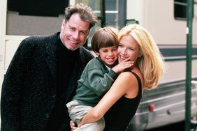 Actress Kelly Preston gets a visit from husband John Travolta (L) and son Jett while on location filming the 1997 motion picture "Addicted to Love." 