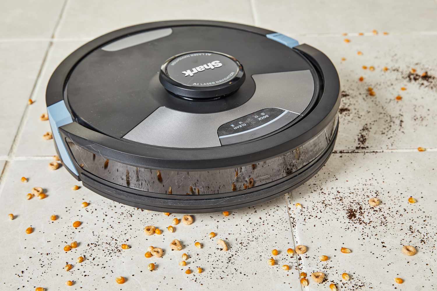 Shark AI Ultra 2-in-1 Robot Vacuum & Mop cleaning food and dirt from tile floor