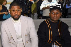 Usher and Naviyd Ely Raymond attend the AMIRI Autumn-Winter 2022 Runway Show