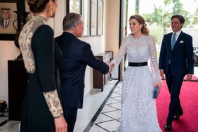A handout picture from the Jordanian Royal Palace shows, King Abdullah II and Queen Rania (L) welcoming Britain's Princess Beatrice and Edoardo Mapelli Mozzi, during a royal ceremony at the Zahran Palace in Amman