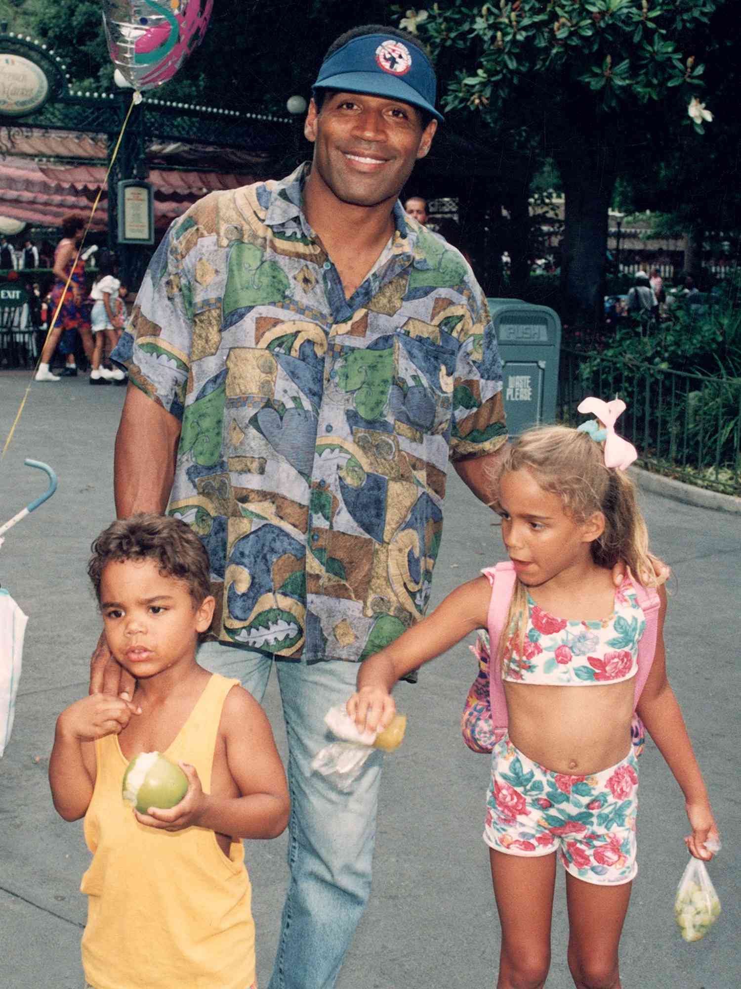 O. J. Simpson with children Justin and Sydney at Disneyland.