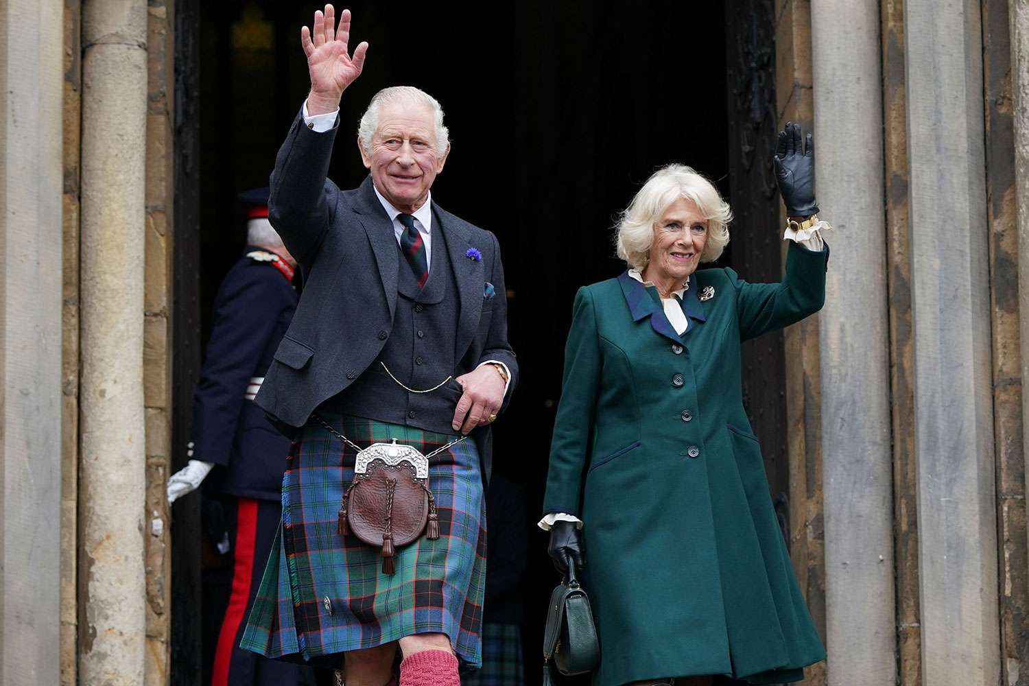 King Charles III and Camilla, Queen Consort, waves as they leave Dunfermline Abbey, after a visit to mark its 950th anniversary, and after attending a meeting at the City Chambers in Dunfermline where the King formally marked the conferral of city status on the former town on October 3, 2022 in Dunfermline, Scotland.