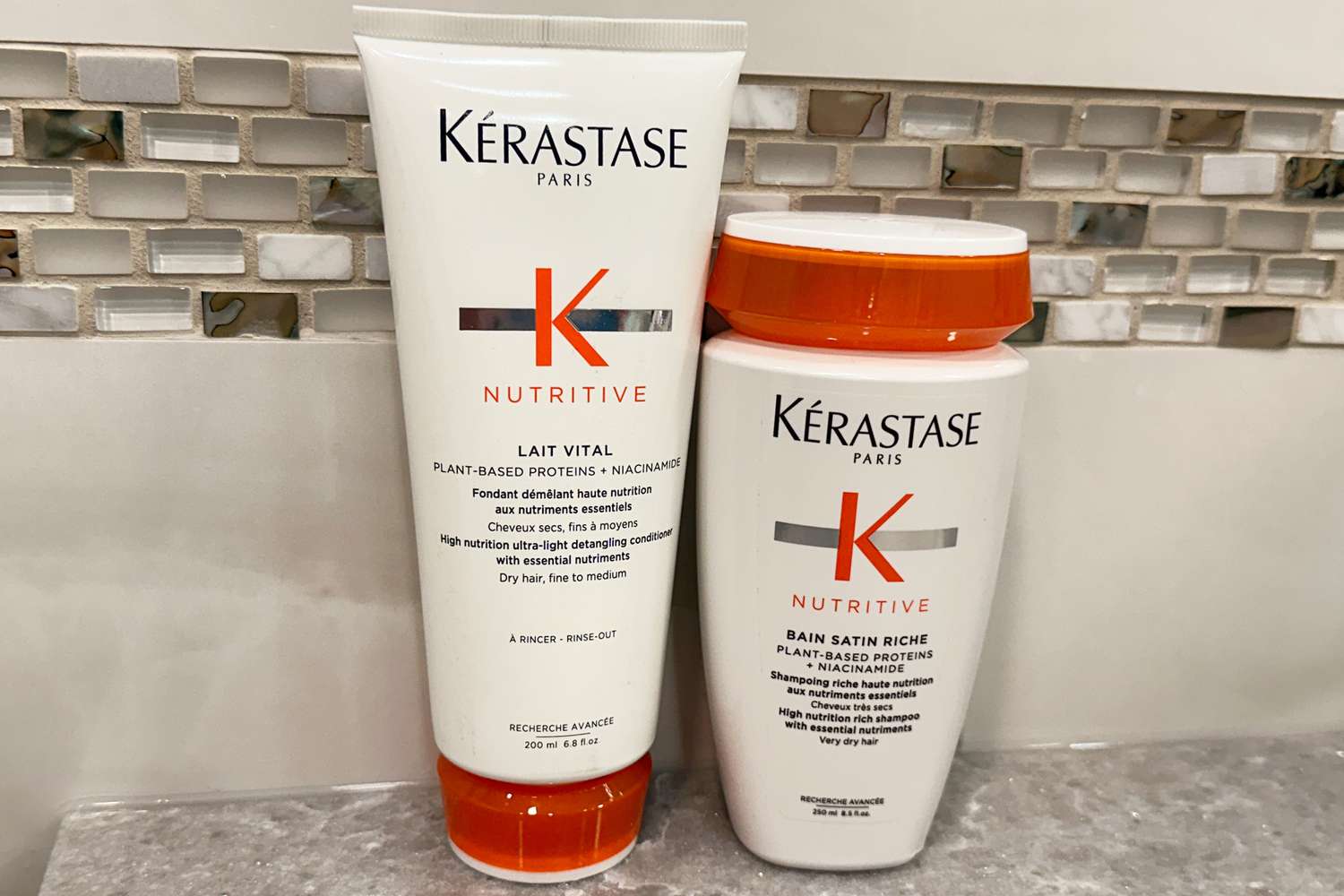 Bottles of KÃ©rastase Nutritive Lait Vital Shampoo and Conditioner