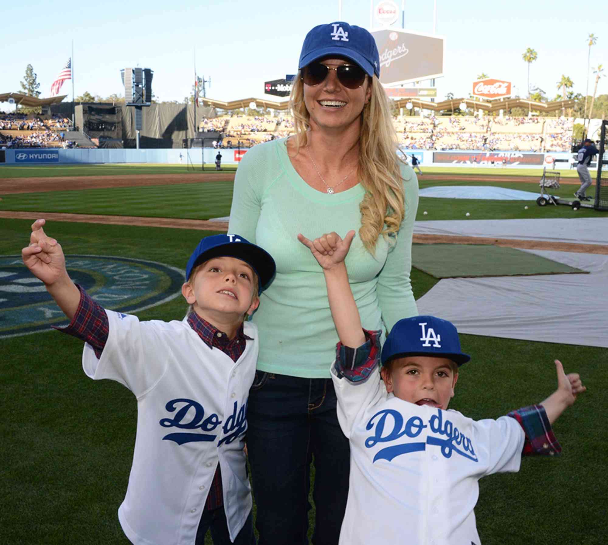 Britney Spears poses with sons Jayden James Federline (L) and Sean Preston Federline (R) during agame against the San Diego Padres at Dodger Stadium on April 17, 2013 in Los Angeles, California