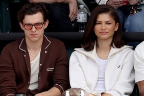 Tom Holland and Zendaya watches Carlos Alcaraz of Spain play Daniil Medvedev of Russia during the Men's Final of the BNP Paribas Open at Indian Wells Tennis Garden