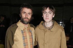  Liam Gallagher (L) and son Gene Gallagher wearing Burberry at the Burberry February 2018 show during London Fashion Week at Dimco Buildings on February 17, 2018 in London, England
