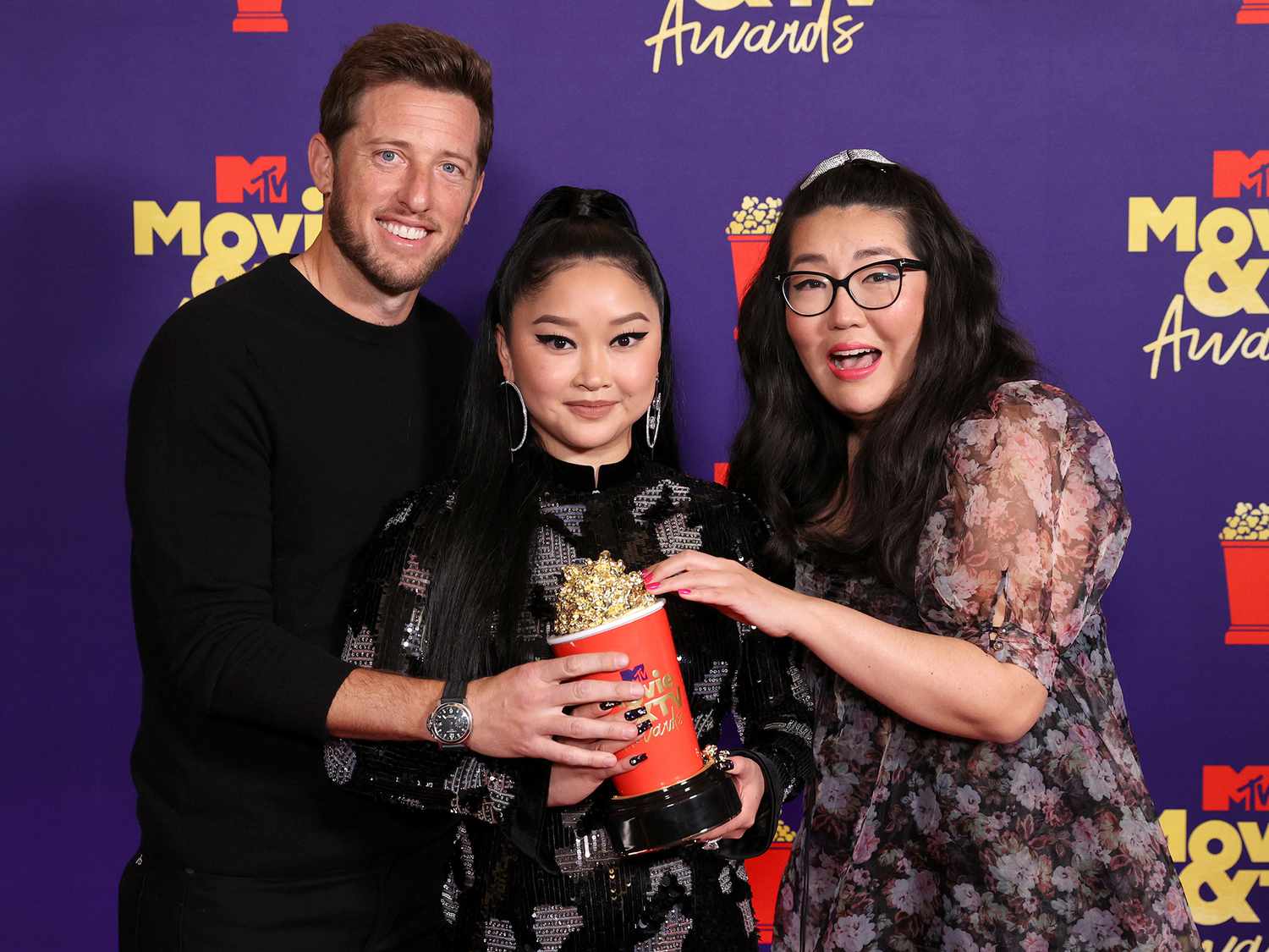 Matt Kaplan, Lana Condor, and Jenny Han pose with the Best Movie award for 'To All the Boys: Always and Forever' backstage during the 2021 MTV Movie & TV Awards