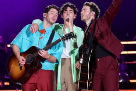Nick Jonas, Joe Jonas, an Kevin Jonas perform onstage during Jonas Brothers "Five Albums, One Night" Tour Opening Night at Yankee Stadium