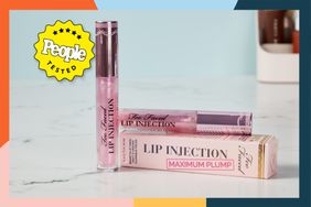 two tubes of Too Faced Lip Injection Maximum Plump Extra Strength on marble surface