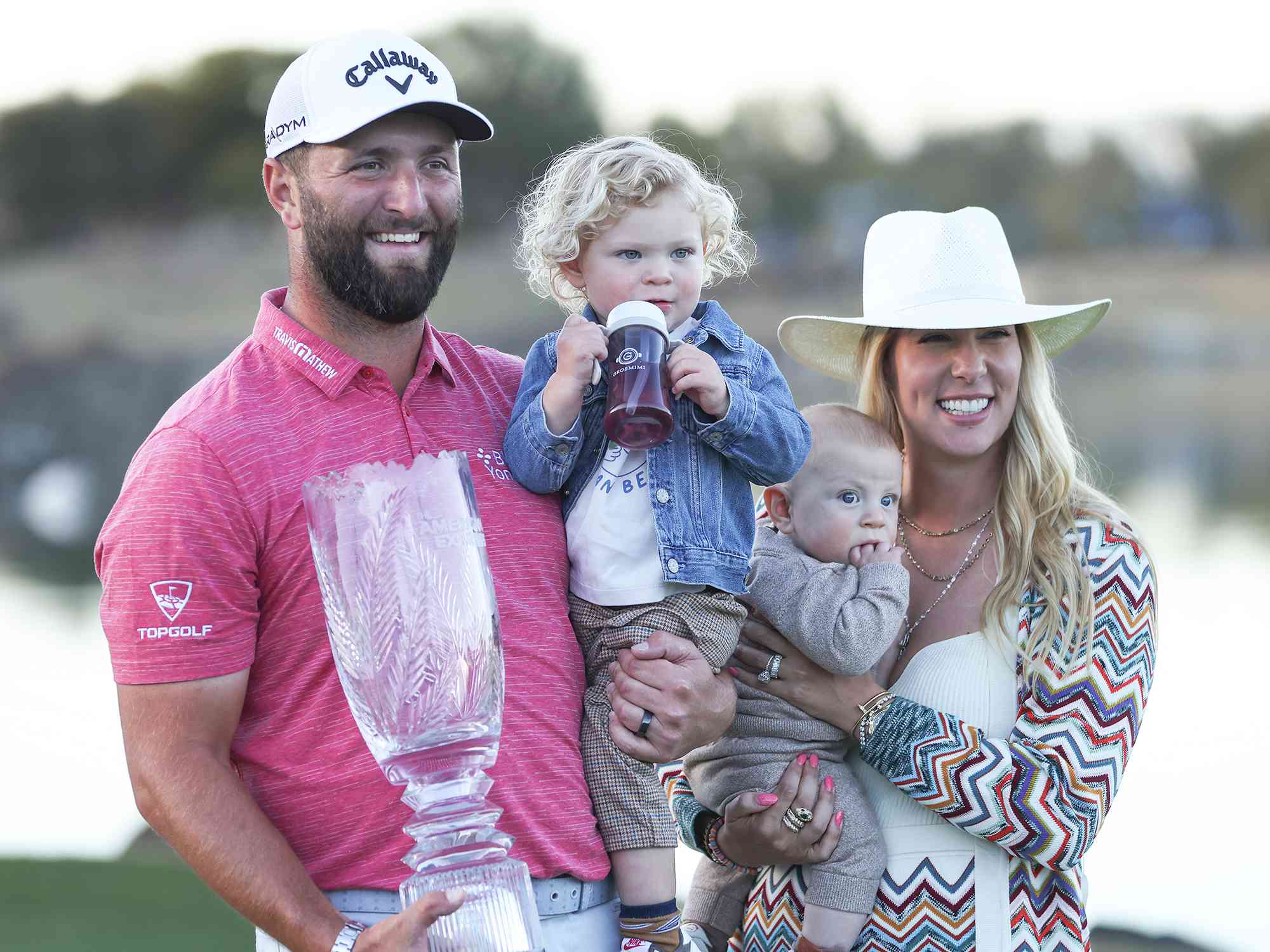Jon Rahm with wife Kelley (R), sons Kepa Cahill Rahm (2nd L) and Eneko Cahill Rahm (2nd R) after winning during the final round of The American Express at PGA West Pete Dye Stadium Course on January 22, 2023 in La Quinta, California