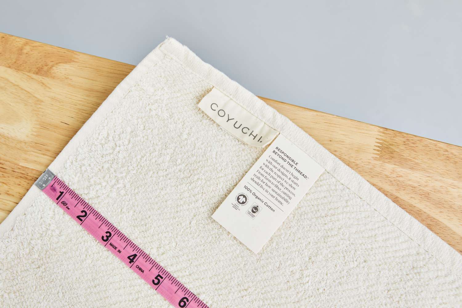 Closeup measuring tape on Coyuchi Air Weight Organic Towels