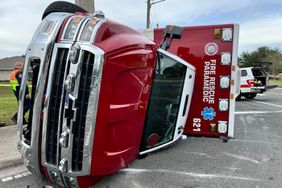 15 Hospitalized After Ambulance Rolls Over While Responding to Car Crash