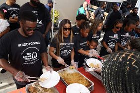 MIAMI, FLORIDA - NOVEMBER 24: Yung Miami (2L) joined Sean "Diddy" Combs (L) and his family, his daughters Chance, D'Lila and Jessie, as they celebrated Thanksgiving Day at The Caring Place in Miami on November 24, 2022 in Miami, Florida. (Photo by Alexander Tamargo/Getty Images for Sean "Diddy" Combs)
