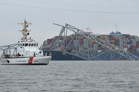 The US Coast Guard Cutter Mako patrols near the collapsed Francis Scott Key Bridge after it was struck by the container ship Dali in Baltimore, Maryland, on March 27, 2024.
