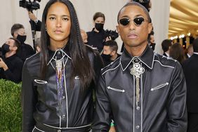 Helen Lasichanh and Pharrell Williams attend The 2021 Met Gala Celebrating In America: A Lexicon Of Fashion at Metropolitan Museum of Art on September 13, 2021 in New York City