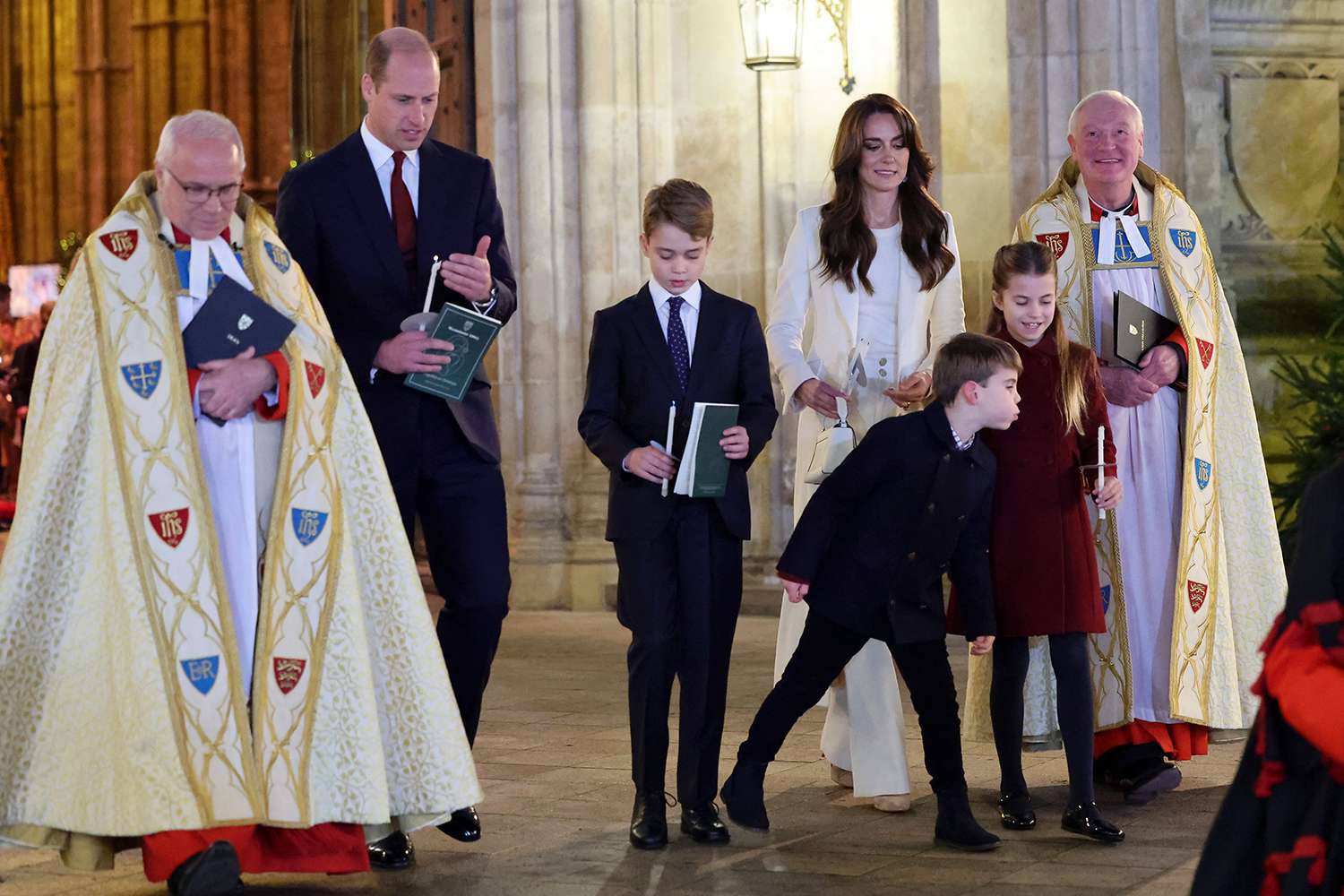 The Dean of Westminster Abbey, The Very Reverend Dr David Hoyle, Prince William, Prince of Wales, Prince George of Wales, Prince Louis of Wales, Catherine, Princess of Wales and Princess Charlotte of Wales attend The "Together At Christmas" Carol Service at Westminster Abbey on December 08, 2023 in London, England.