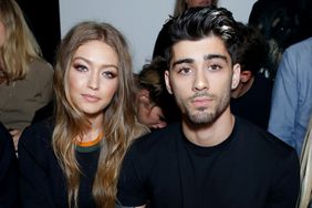 Gigi Hadid and Zayn Malik attend the Versus Versace show during London Fashion Week Spring/Summer collections