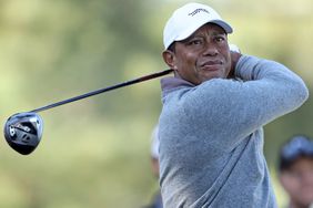 Tiger Woods of the United States plays his shot from the 18th tee during the continuation of the first round of the 2024 Masters Tournament at Augusta National Golf Club on April 12, 2024 in Augusta, Georgia. 