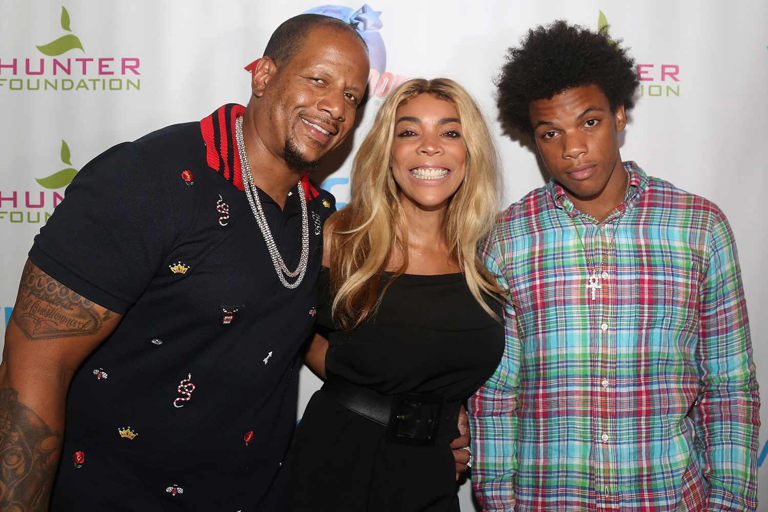 Kevin Hunter, wife Wendy Williams and son Kevin Hunter Jr pose at a celebration for The 