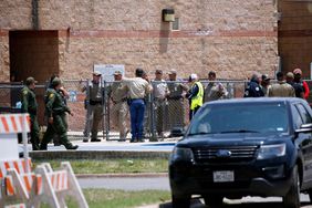 aw enforcement personnel stand outside Robb Elementary School following a shooting, in Uvalde, Texas Texas School Shooting, Uvalde, United States - 24 May 2022