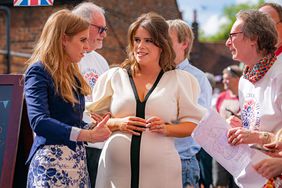 Britain's Princess Beatrice of York (L) and Britain's Princess Eugenie of York (C) attend the Coronation Big Lunch in Chalfont St Giles, north of London on May 7, 2023. - Tens of thousands of street parties were planned as Britain celebrated the coronation of King Charles III ahead of a concert for 20,000 people at Windsor Castle.