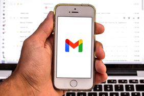  In this photo illustration, the Google Gmail seen displayed on a smartphone screen and a Google Gmail website on a laptop in the background.