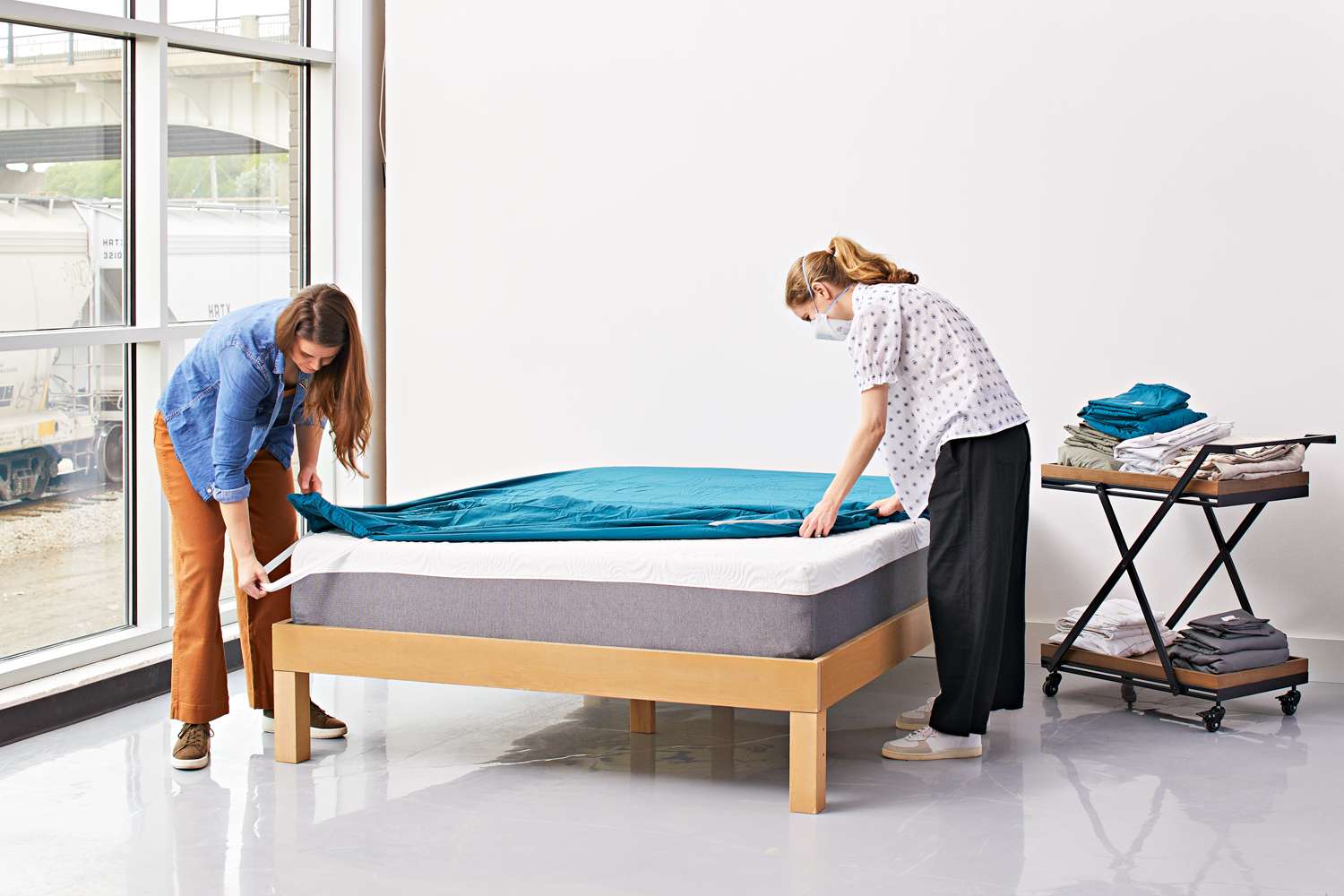 two people making a bed with Cosy House Collection Luxury Bamboo Sheets