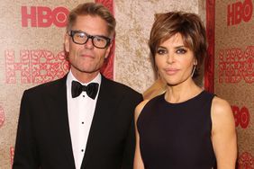 Actor Harry Hamilin (L) and actress Lisa Rinna attend HBO's Official Golden Globe Awards After Party at The Beverly Hilton Hotel on January 12, 2014 in Beverly Hills, California.